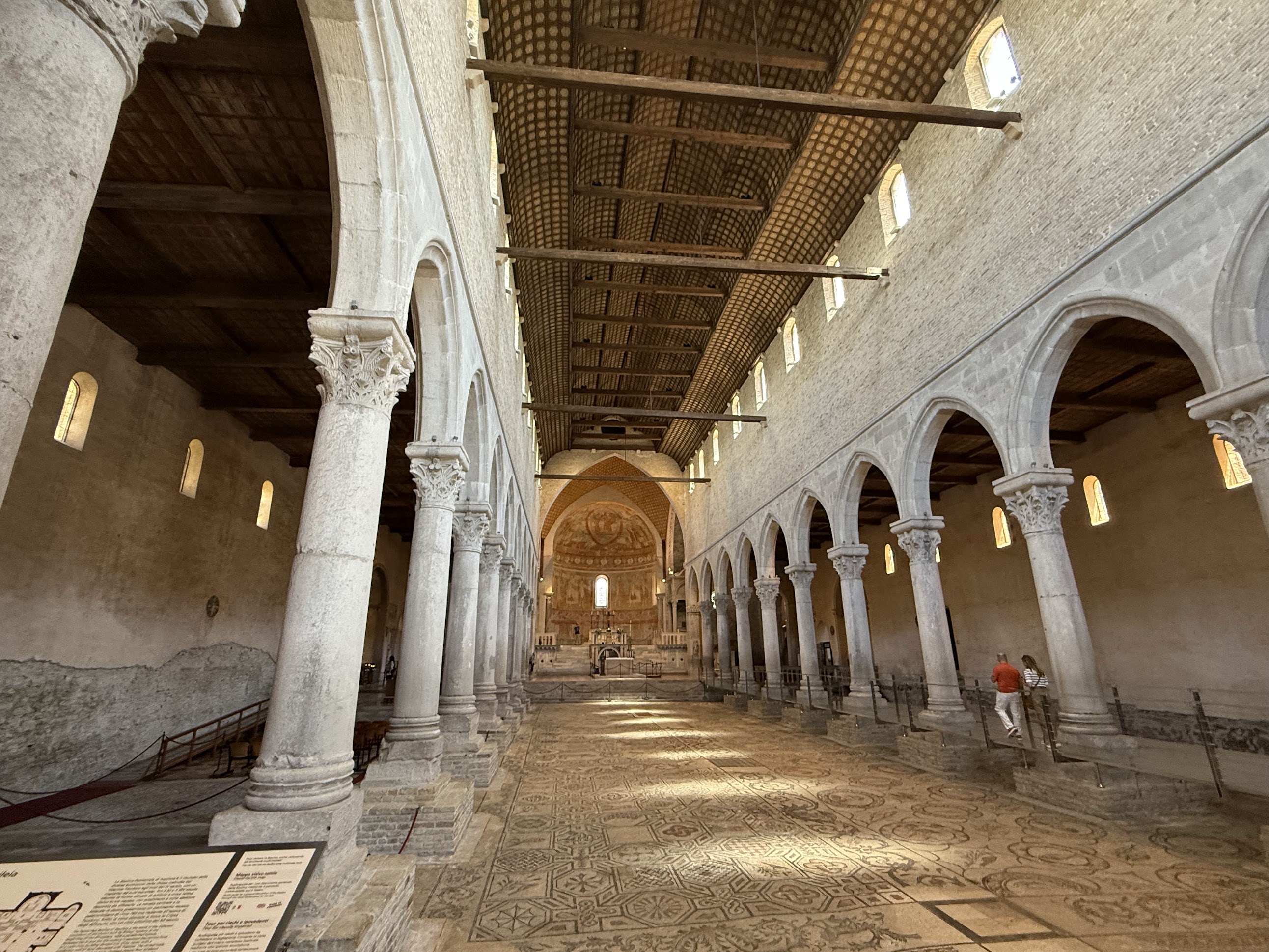 Church nave, lined by columned porticas with the mosaic floor in the middle